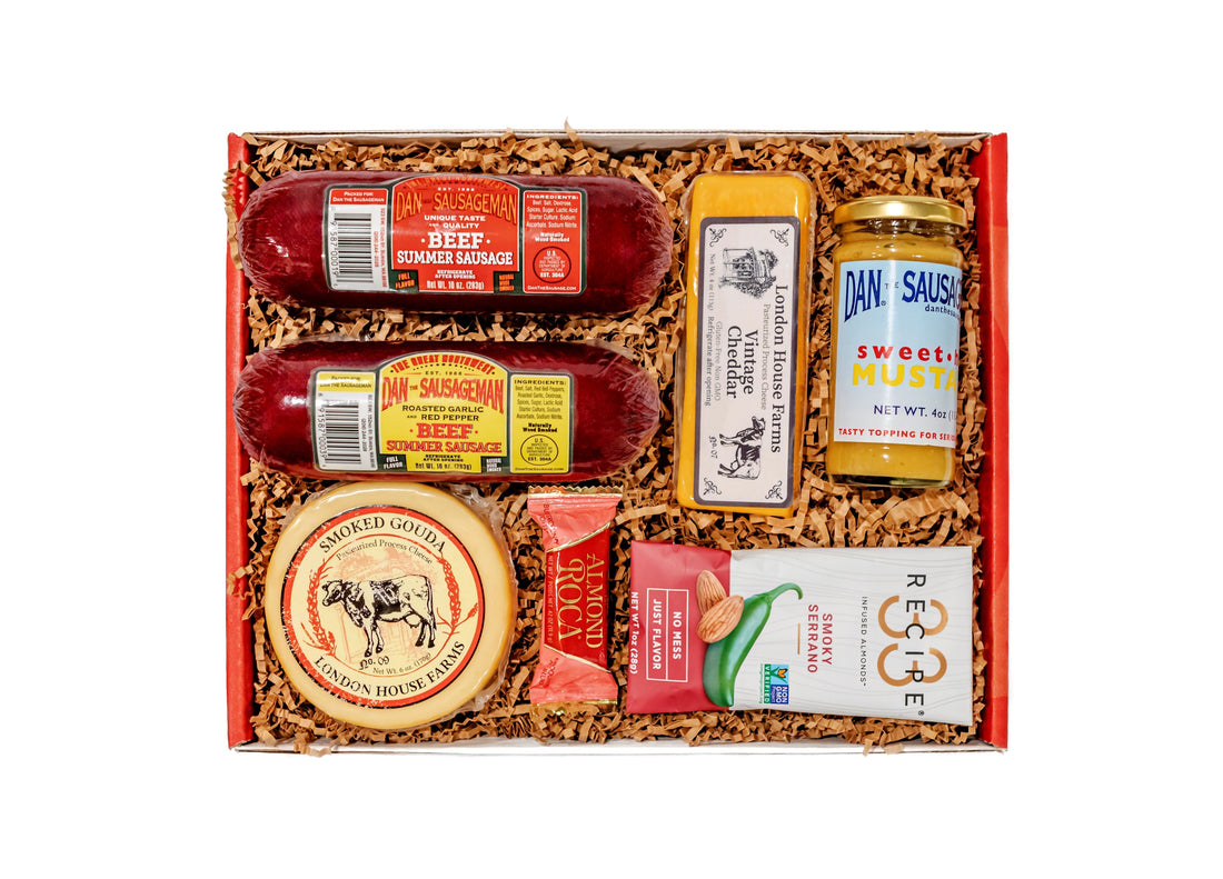 An open Dan the Sausageman Heritage gift box with summer sausage and cheese