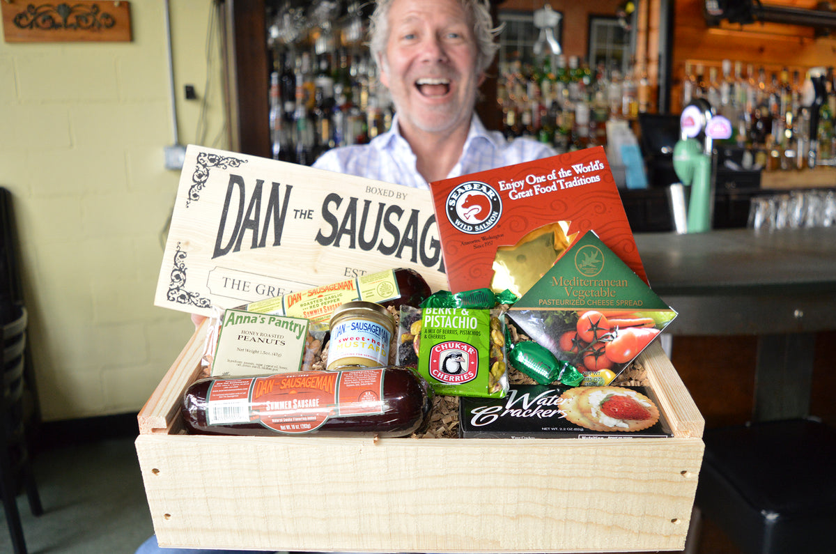 Dan the Sausageman holding a gift basket